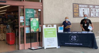 Project SAVE Community Health Workers outside of a grocery store