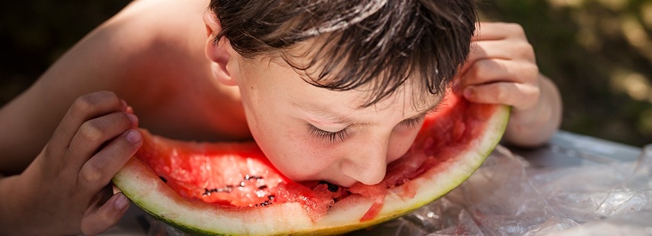 Boy eating watermelon