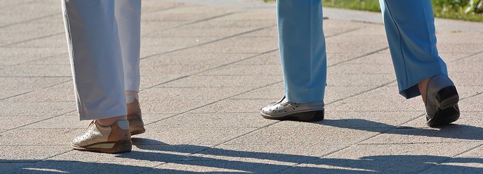 Two women walking down a path
