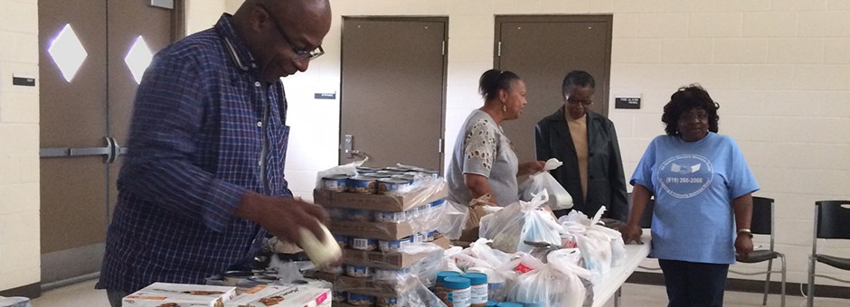 Feeding America Volunteers Serve Food to Seniors