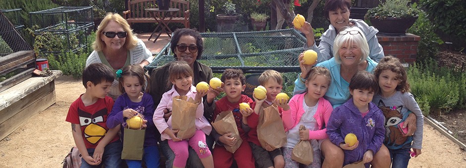 Seniors and toddlers enjoy a day at the garden together