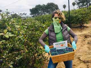 ProduceGood Employee Holding Fruit