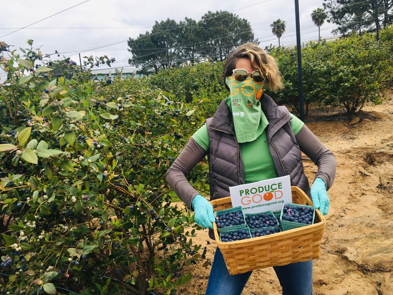 ProduceGood Employee Holding Fruit