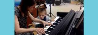 woman teaching child piano
