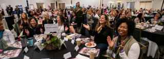 San Diego Women's week conference with people clapping 2019