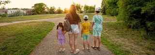 Mother walks with children