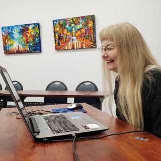 Senior engaging in online learning