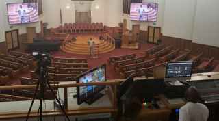 Pastor Benson delivers a virtual sermon from Total Deliverance Worship Center