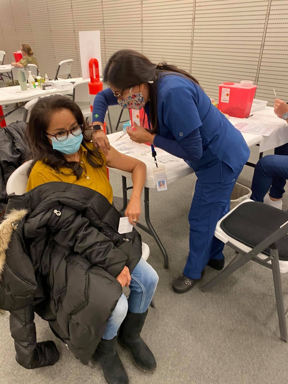 Women getting flu vaccine at a clinic