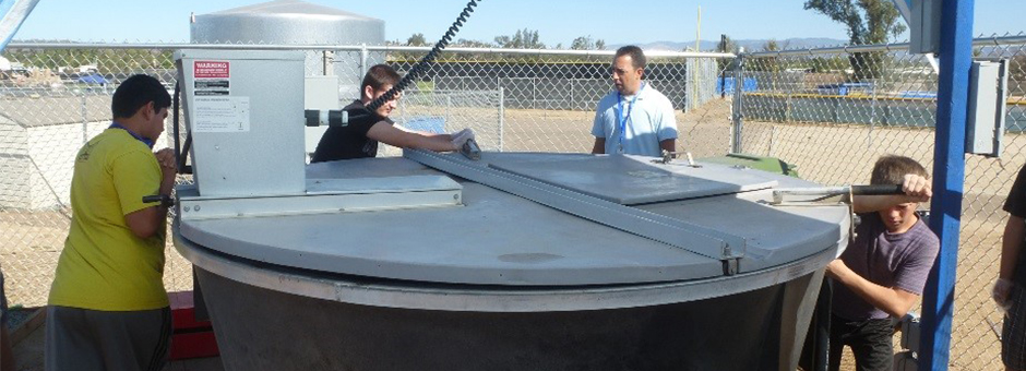 Students at Ramona High School monitor the composting process in the Earth Tub. 