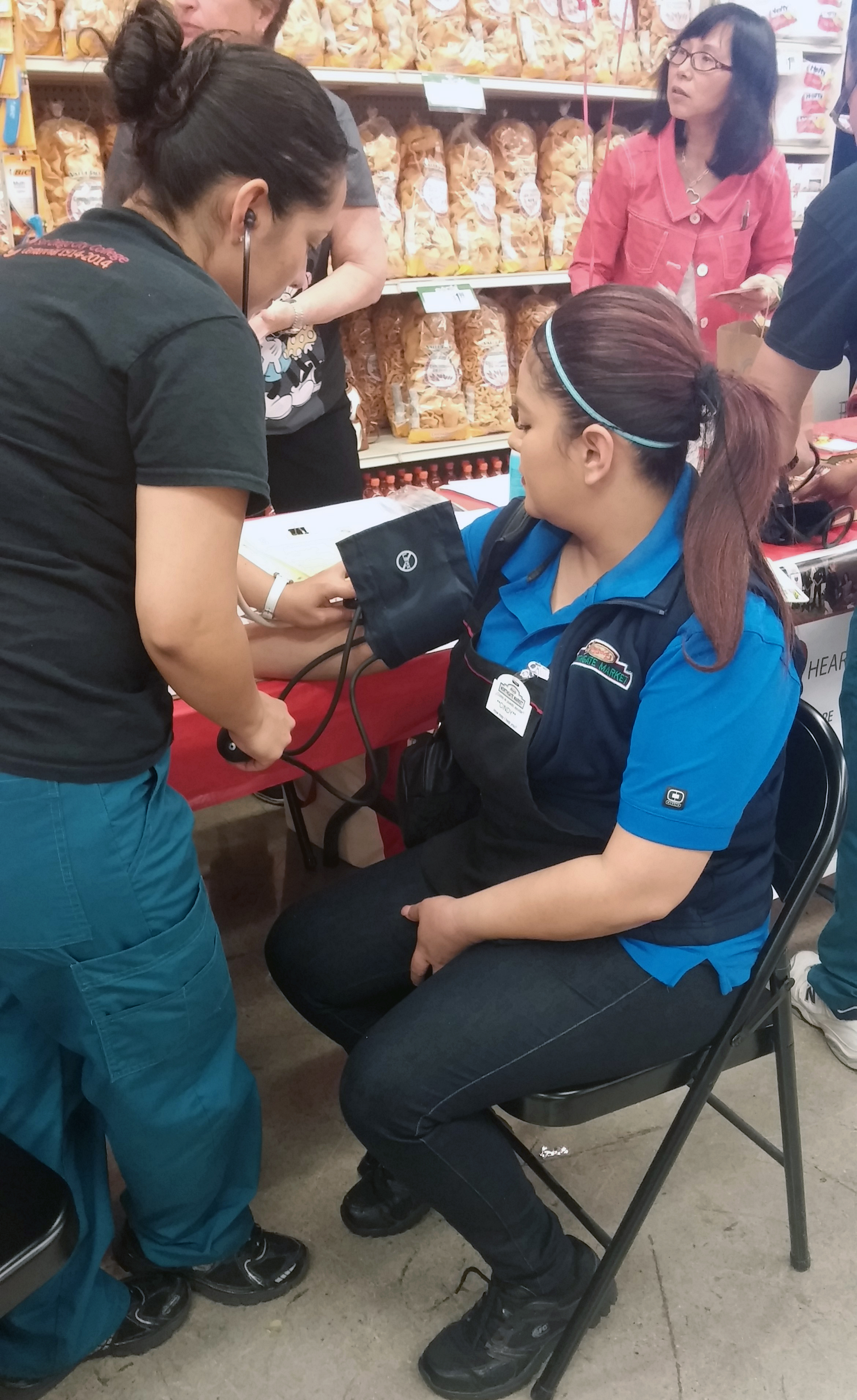 Cindy Garcia, Northgate Gonzalez employee at the City Heights site, got her blood pressure checked at the end of her shift